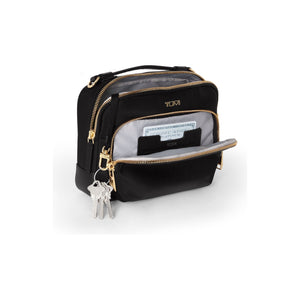 Black Tumi Voyageur Teghan Crossbody Bag with gold accents, showing its sleek design and adjustable strap.