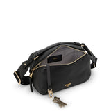 Black Tumi Voyageur Berlin crossbody bag with gold accents, showcasing its compact design and adjustable strap.