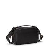 Black Tumi Voyageur Berlin crossbody bag with light gold accents, compact design, and adjustable strap for everyday use.