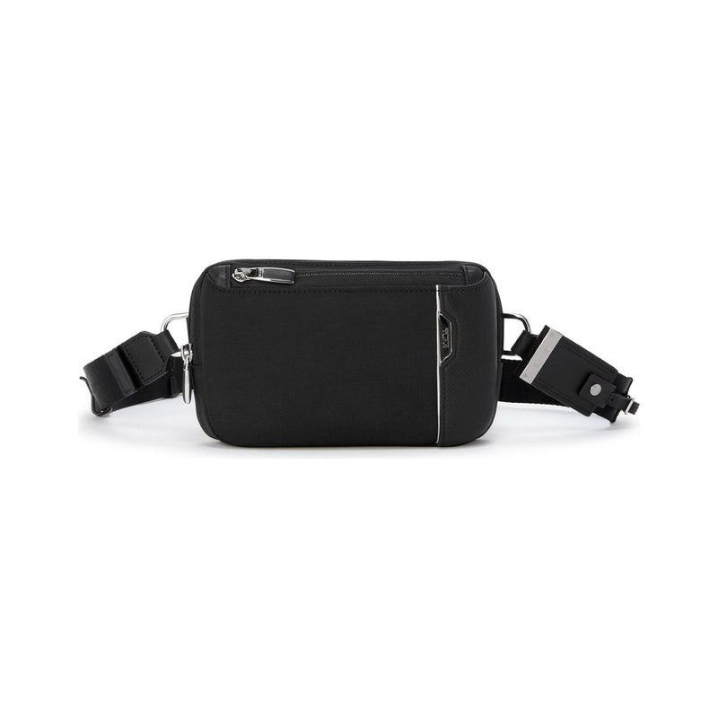 Tumi Arrivé Messina Utility Pouch sling bag with compact design, black fabric, and adjustable strap for versatile carrying.