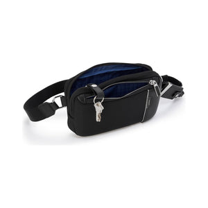 Tumi Arrivé Messina Utility Pouch sling bag with adjustable strap and durable fabric, designed for versatile everyday use.