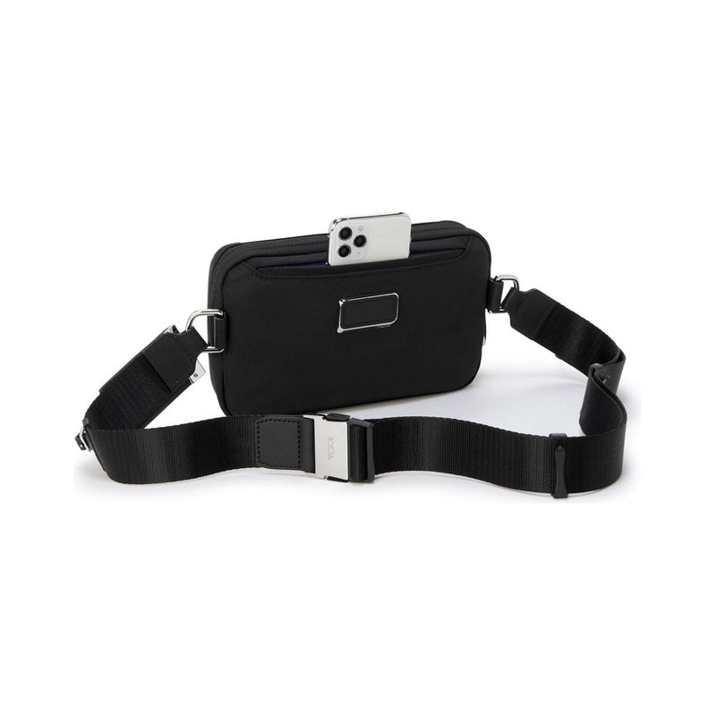 Tumi Arrivé Messina Utility Pouch sling bag in black with adjustable strap and compact design for everyday use.