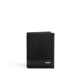 Tumi Alpha passport cover in black leather with sleek design and Tumi logo on front.
