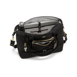 Tumi Voyageur Contine Weekender duffel bag in durable fabric with leather accents, showing side view and handles.