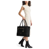 Tumi Voyageur Contine Weekender duffel bag in durable fabric with leather accents, featuring handles and a spacious main compartment.