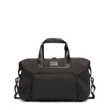 Tumi Alpha double expansion travel satchel duffel bag with sturdy handles and spacious main compartment, black leather accents.