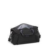Tumi Alpha double expansion travel satchel showing durable black duffel bag with handles and zipper closure, designed for travel.