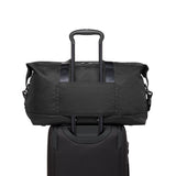 Tumi Alpha Double Expansion Travel Satchel with sturdy handles and spacious interior, ideal for durable duffel bag travel.