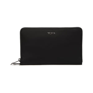 Tumi Voyageur Vevay Jewelry Portfolio jewelry case with multiple compartments and a sleek, tan leather exterior.