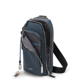 Tumi Harrison Gregory Sling bag in black with adjustable strap and multiple compartments, designed for casual and travel use.