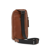 Tumi Harrison Gregory sling bag in black with adjustable strap and multiple compartments, designed for everyday use.