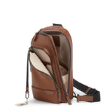 Tumi Harrison Gregory Sling bag in black with adjustable strap and multiple compartments, designed for versatile everyday use.