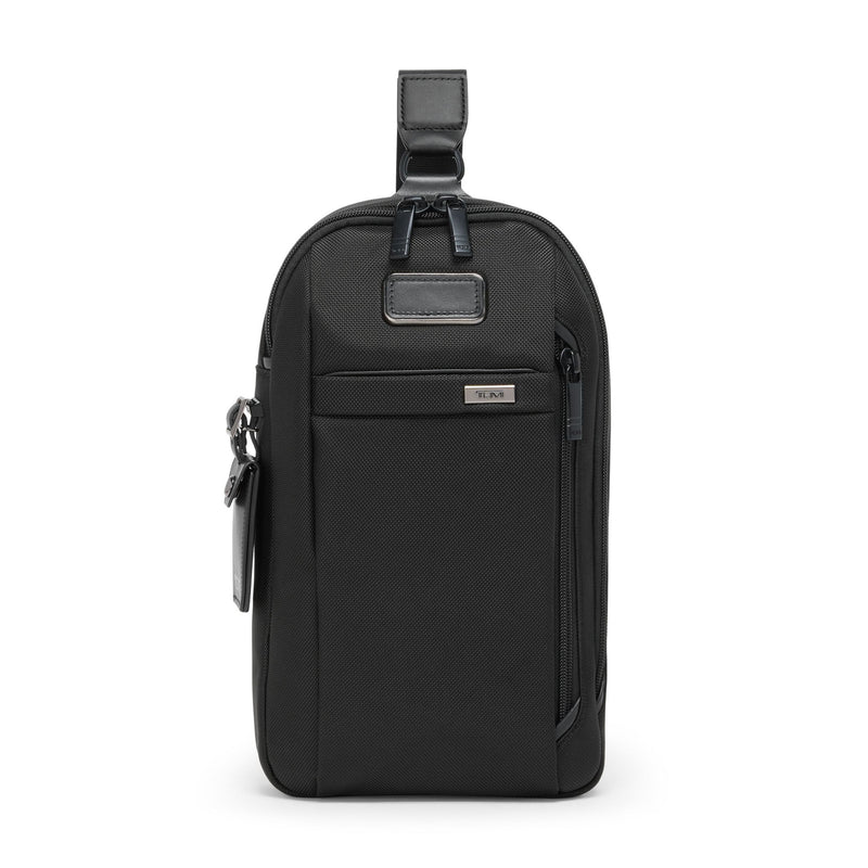 Tumi Alpha Sling bag in black with adjustable strap and multiple compartments, designed for convenient everyday carry
