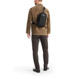 Tumi Alpha Sling bag with adjustable strap and multiple compartments, designed for stylish everyday carry.