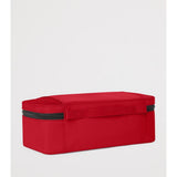 Tumi packing cubes in various sizes, made of durable fabric, organized for travel storage.