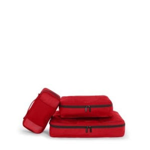 Tumi packing cubes set with multiple organized compartments for travel storage and organization in a sleek design.