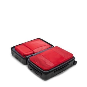 Tumi packing cubes set with multiple organized compartments for travel storage and packing efficiency.