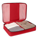 Tumi packing cubes set with multiple organized fabric storage bags for travel organization.