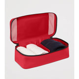 Red Tumi small packing cube for organized travel storage, featuring multiple compartments and durable design.