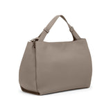 Taupe Tumi Georgica Marylea Crossbody bag with adjustable strap and sleek design, featuring subtle branding and spacious interior.