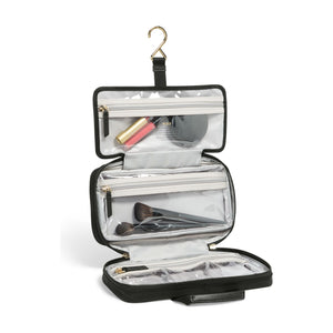 Black Tumi Voyageur Small Madeline Cosmetic Case with gold accents, compact toiletry bag for travel essentials.
