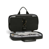 Black Tumi Voyageur Small Madeline Cosmetic Case, a compact toiletry bag with gold accents and durable travel-ready design.
