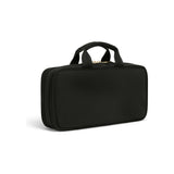 Black Tumi Voyageur Small Madeline cosmetic case with gold accents, compact toiletry bag for travel essentials.