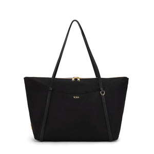 Black Tumi Voyageur Q Tote bag with gold accents, showing its spacious design and sturdy handles for everyday use.
