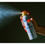 Vacation Classic Spray 30 SPF sunscreen bottle with clear label, designed for easy application and outdoor sun protection.