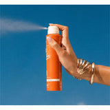 Vacation Orange Gelée SPF 30 sunscreen in a tube, displaying the bright orange packaging and product label.