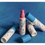 Vacation Super Spritz SPF 50 sunscreen spray bottle with bright packaging and spray nozzle, designed for sun protection.