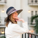 Black Marseille UPF 50+ packable hat by Wallaroo Hat Company, featuring wide brim and lightweight, foldable design.