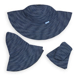 Wallaroo Hat Company navy and white dotted packable UPF 50+ hat with a scrunchie, designed for sun protection and easy packing.