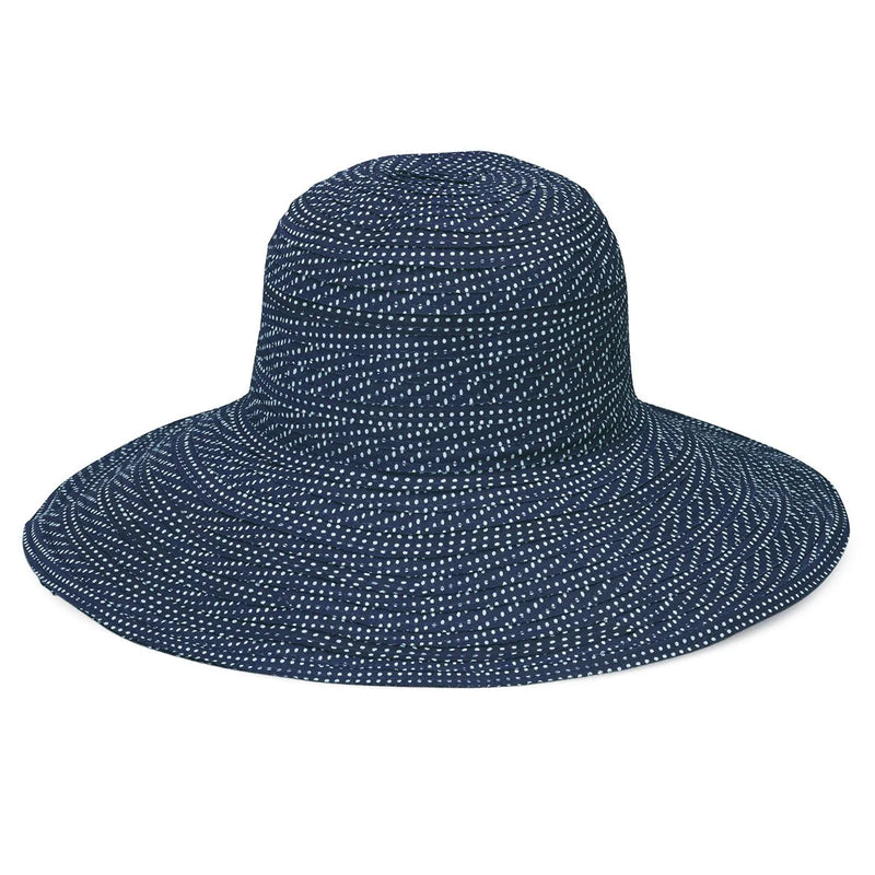 Wallaroo Hat Company navy and white polka dot packable UPF 50+ hat with a matching scrunchie, designed for sun protection.