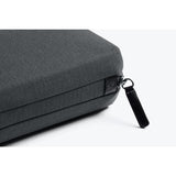 Bellroy Tech Kit showing organized compartments with cables, chargers, and tech accessories in a sleek, compact design.