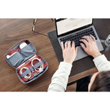 Bellroy Tech Kit with multiple compartments for organizing cables, chargers, and accessories in a sleek, durable design.