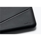 Black Bellroy Flip Case wallet with sleek design, featuring card slots and a compact fold-over style.