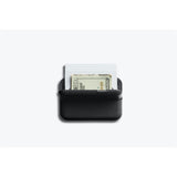 Black Bellroy Flip Case wallet with multiple card slots and a sleek, slim design for carrying essentials.