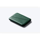Black Bellroy Flip Case wallet with card slots and sleek design, shown open with visible compartments for cards and cash.