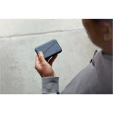 Black Bellroy Flip Case wallet showing multiple card slots and sleek leather design.