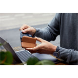 Black Bellroy Flip Case wallet with card slots and sleek design, showcasing the compact and stylish wallet in a close-up shot.