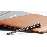 Bellroy travel wallet in caramel leather, featuring multiple card slots and a sleek, compact design for organized travel essentials.