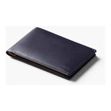 Bellroy Travel Wallet in caramel leather featuring multiple card slots and a sleek, compact design for organized travel storage.