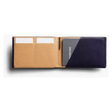 Bellroy travel wallet in caramel leather with multiple card slots and compartments for secure organization.
