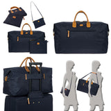 Bric's X-Collection 22-inch Deluxe Duffle bag in navy with leather accents and multiple zipper compartments.