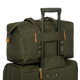 Bric's X-Collection 18-inch folding duffle bag in durable fabric with handles and zipper closure, designed for travel.