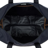 Bric's X-Collection 18-inch folding duffle bag in durable fabric with handles and zipper closure, folded for compact storage