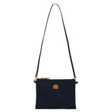 Bric's X-Collection 18-inch folding duffle bag with black nylon fabric and leather accents, shown folded and partially unfolded.