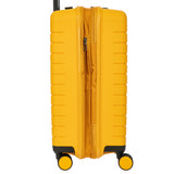 Bric's B|Y Ulisse 21-inch expandable spinner luggage with sleek design and four wheels for smooth travel.