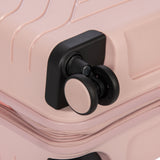 Bric's B|Y Ulisse 21-inch expandable spinner luggage with sleek design, four wheels, and a sturdy handle for easy travel.